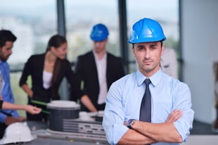 business people group on meeting and presentation in bright modern office with construction engineer architect and worker looking building model and blueprint planbleprint plans
