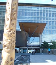 Entrance shot of the Christchurch Civic Offices showing Māori carving in the foreground.